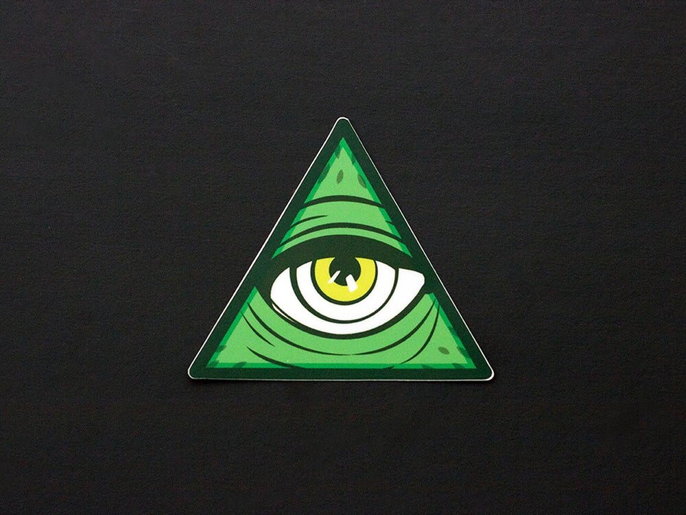 Green triangle sticker with a single wide eye