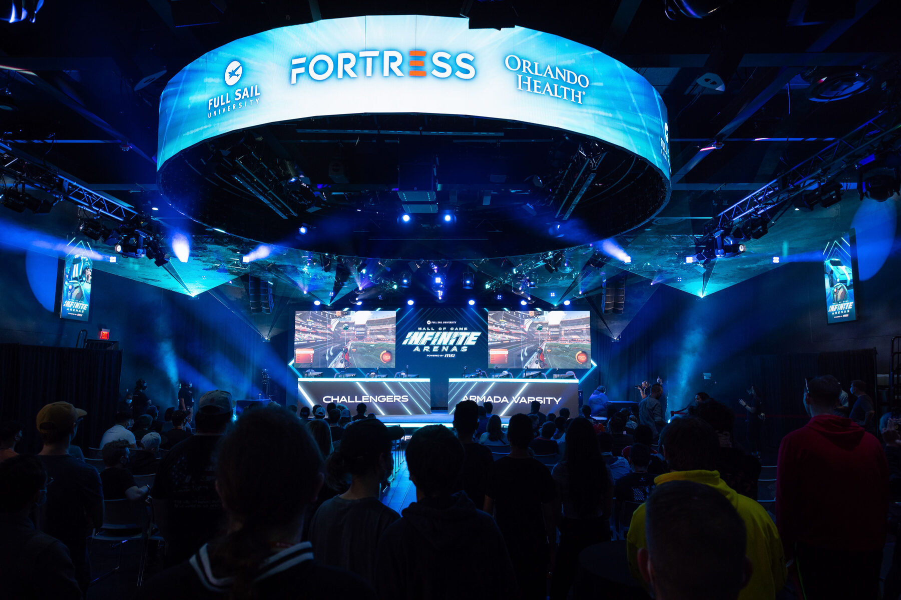 A packed crowd facing the stage under the Orlando Health Fortress ring