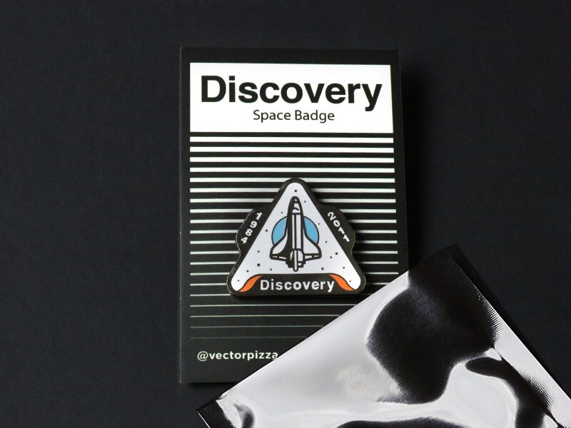 Discovery pin on its Space Badge backing card