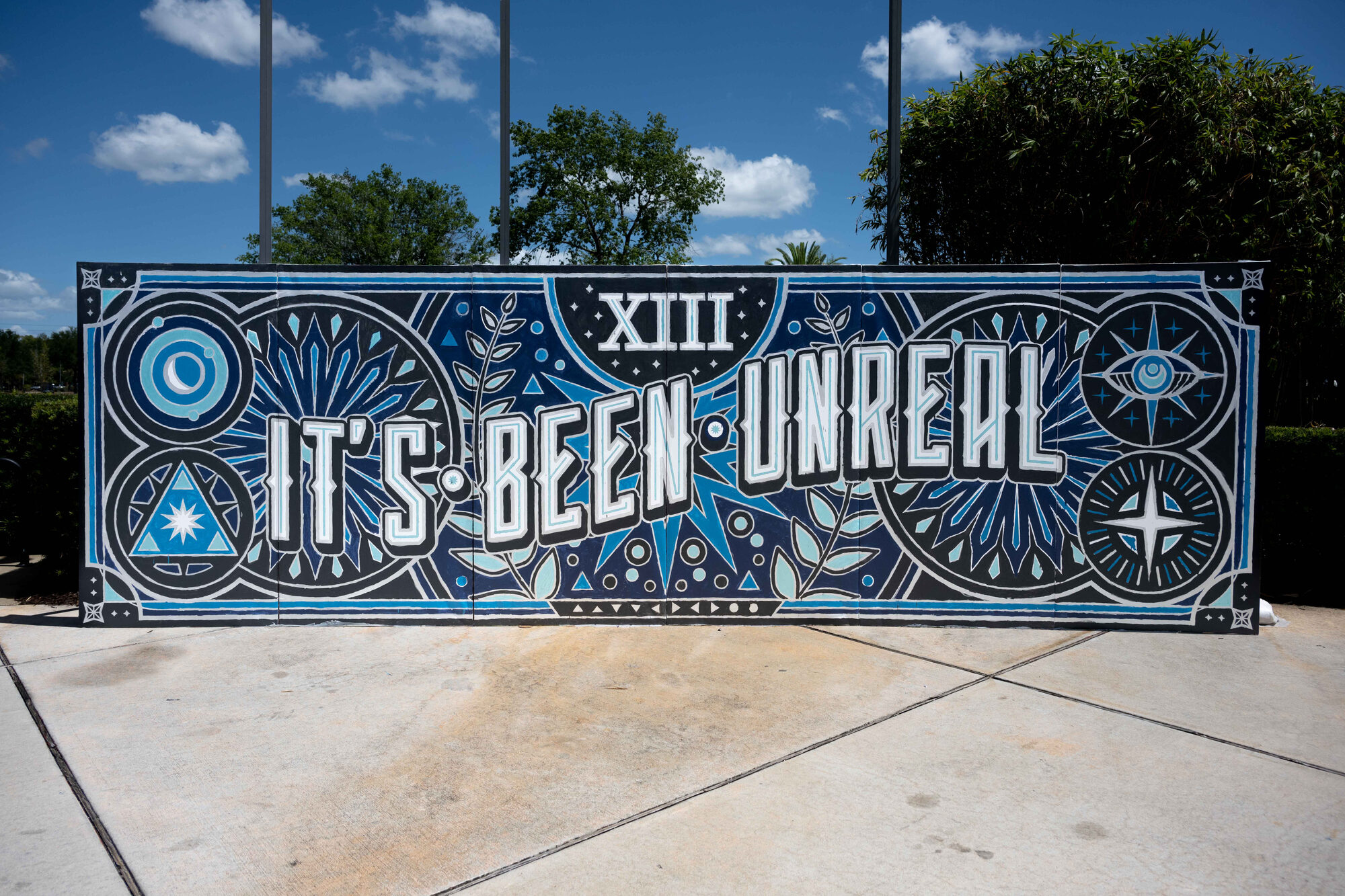 The It’s Been Unreal mural installed outdoors and painted in
