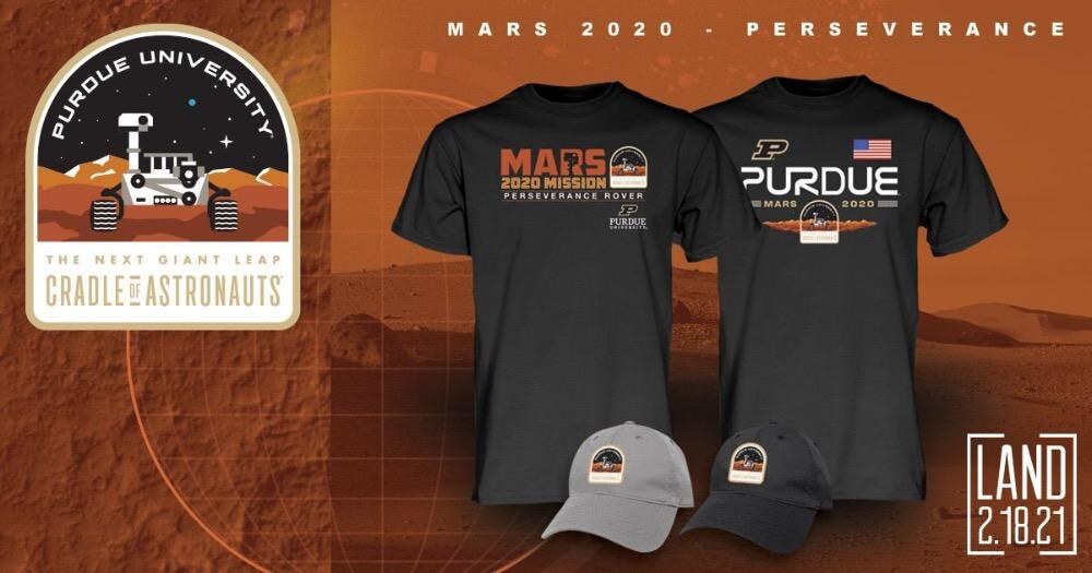 The final Purdue Cradle of Astronauts patch beside two Mars 2020 T-shirts and two caps carrying it